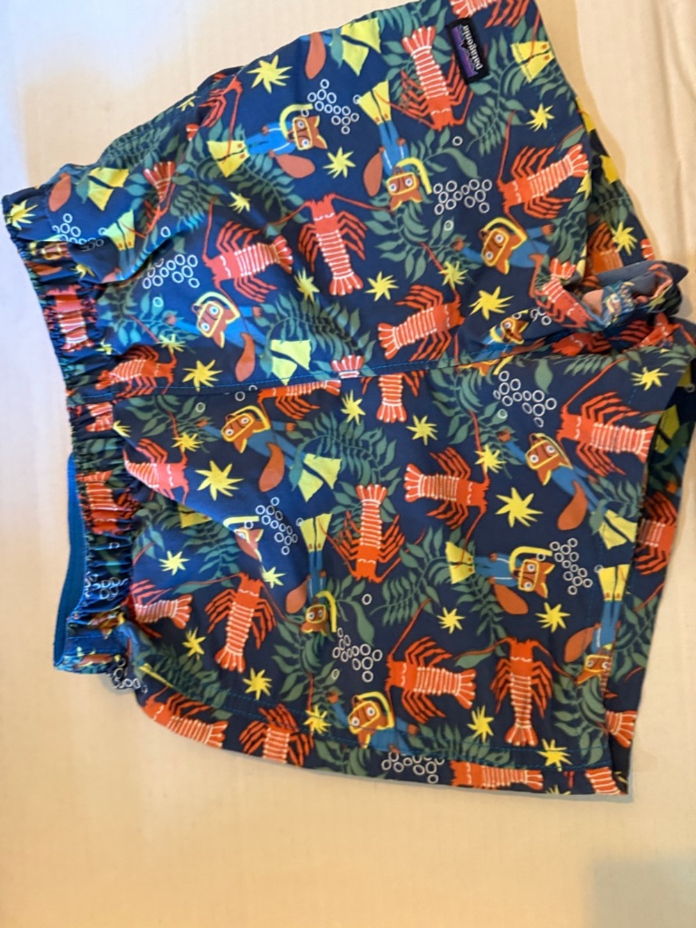 Patagonia Baby Baggies Shorts with Orange Lobsters and Yellow Stars